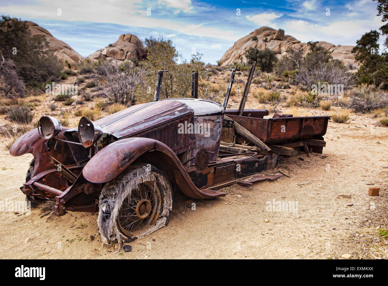 An abandoned car left over from the Wall Street Mill and Mine in Joshua Tree National Park, California, USA. Stock Photo