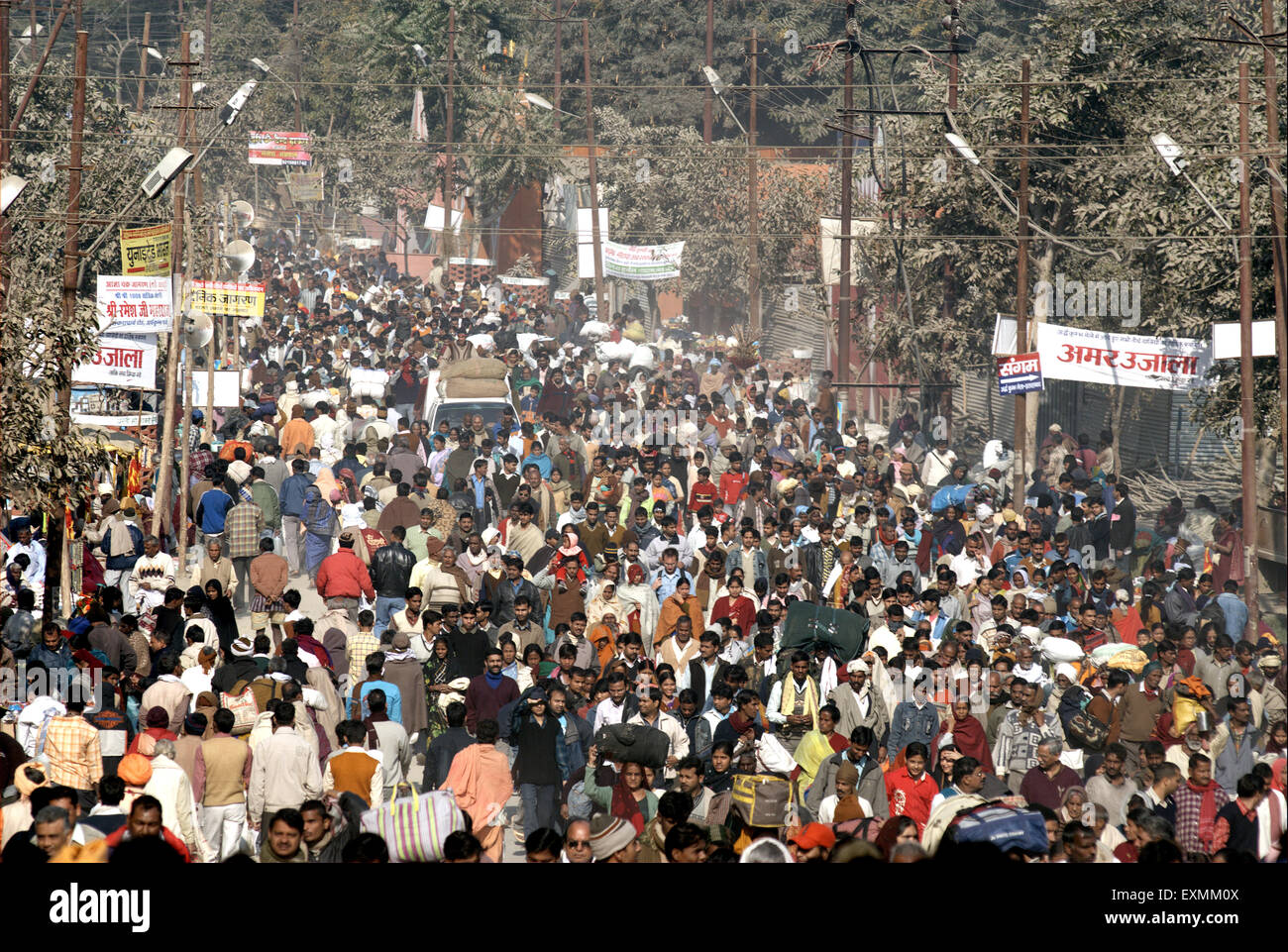 devotees walk towards confluence Ganges Yamuna mythical Saraswati rivers holy Ardh Kumbh Mela Allahabad Uttar Pradesh Stock Photo