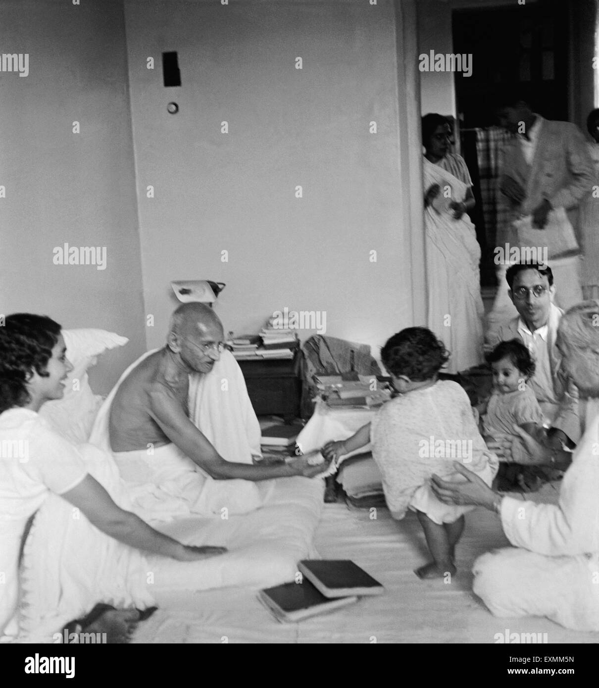 Mahatma Gandhi interacting with a small child at Birla House ; Mumbai ; 1945 ; Sushila Nayar NO MR Stock Photo