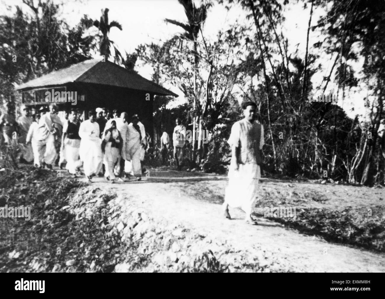 Mahatma Gandhi and his party on the march through the riot effected areas in Noakhali ; East Bengal Stock Photo