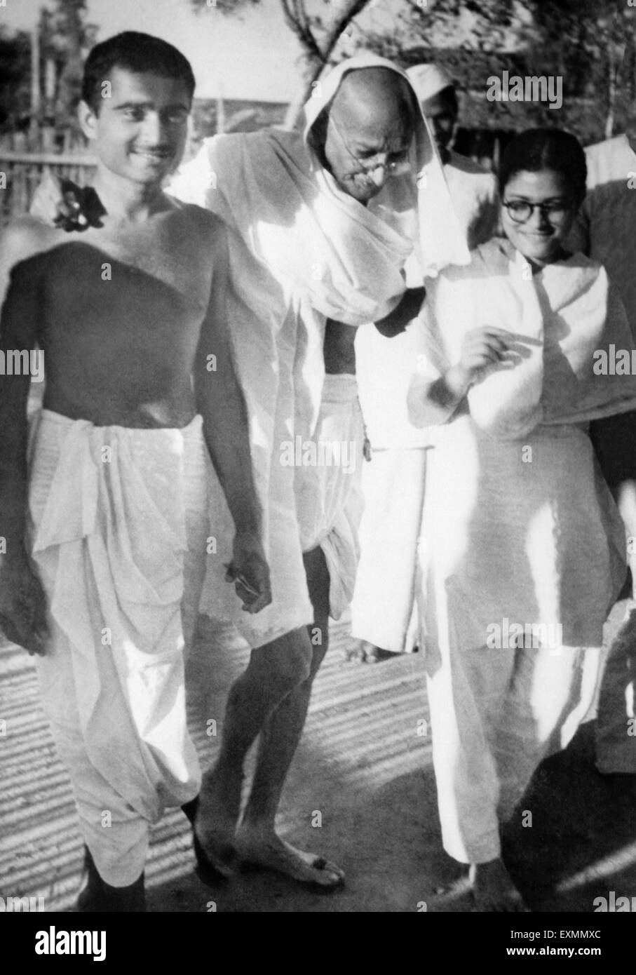 Mahatma Gandhi walking supported boy girl India Stock Photo - Alamy