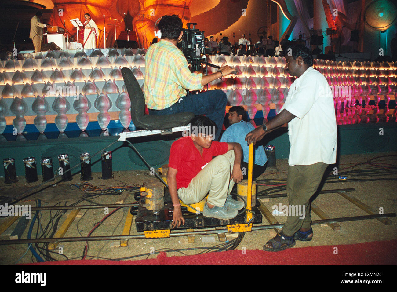 Cameraman cinematographer camera crew trolley shooting Lata Mangeshkar night, Bombay, Mumbai, Maharashtra, India, Asia Stock Photo