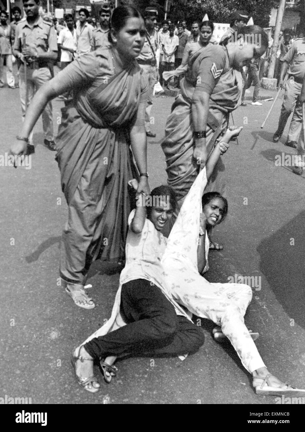 Police women arresting girl protesters Bombay Mumbai Maharashtra India Stock Photo