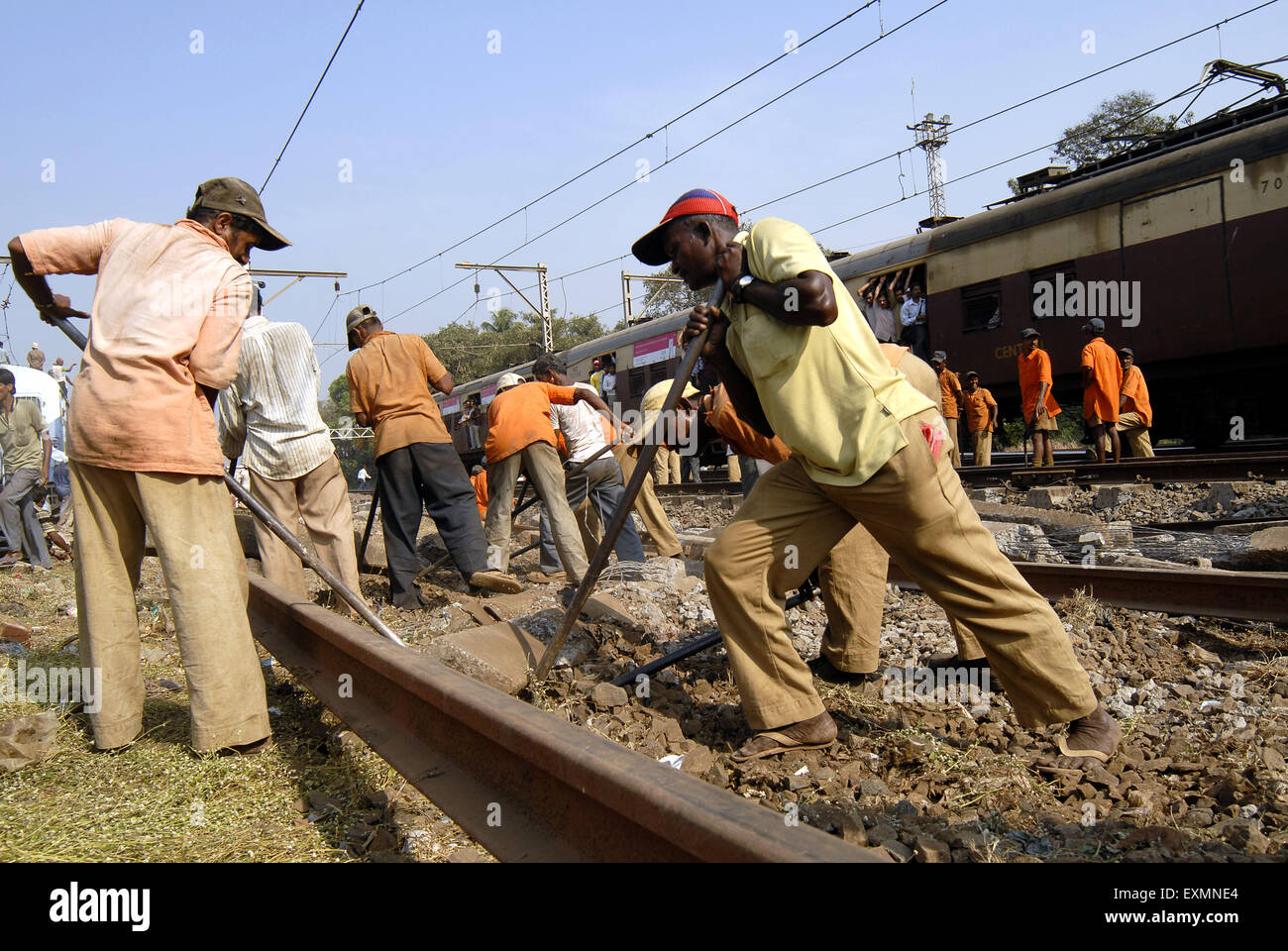 Railway workers repair damaged railway tracks after local derailed