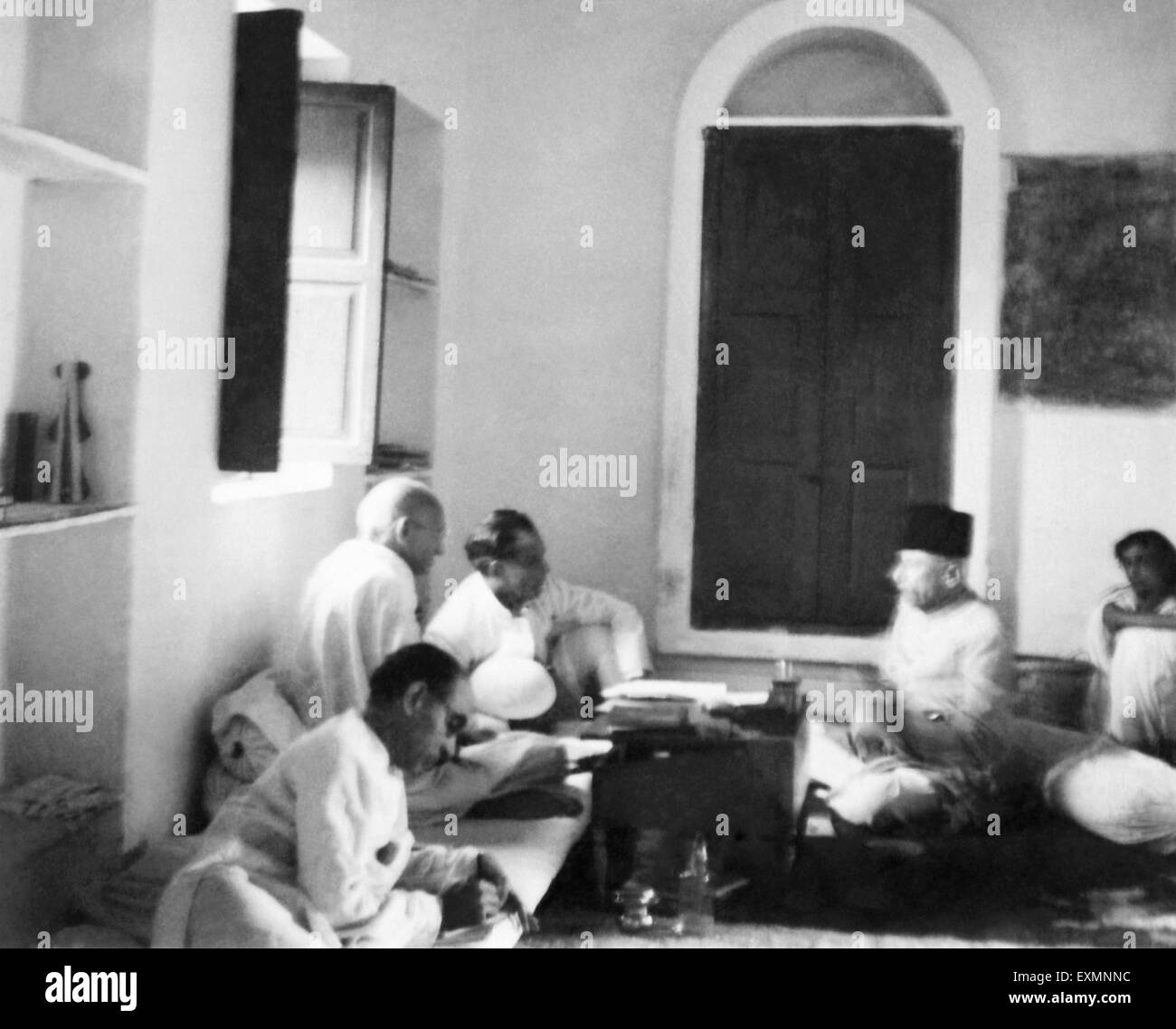 Mahatma Gandhi talking with Abdul Kalam Maulana Azad and others at Bhangi sweeper's Colony ; New Delhi Stock Photo