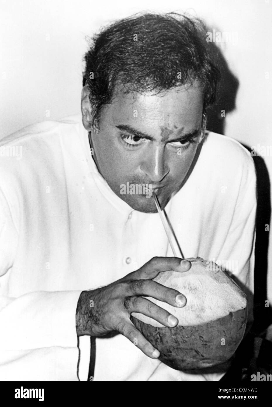 Indian politician of Indian National Congress Party and former Prime Minister Rajiv Gandhi drinking coconut water Stock Photo