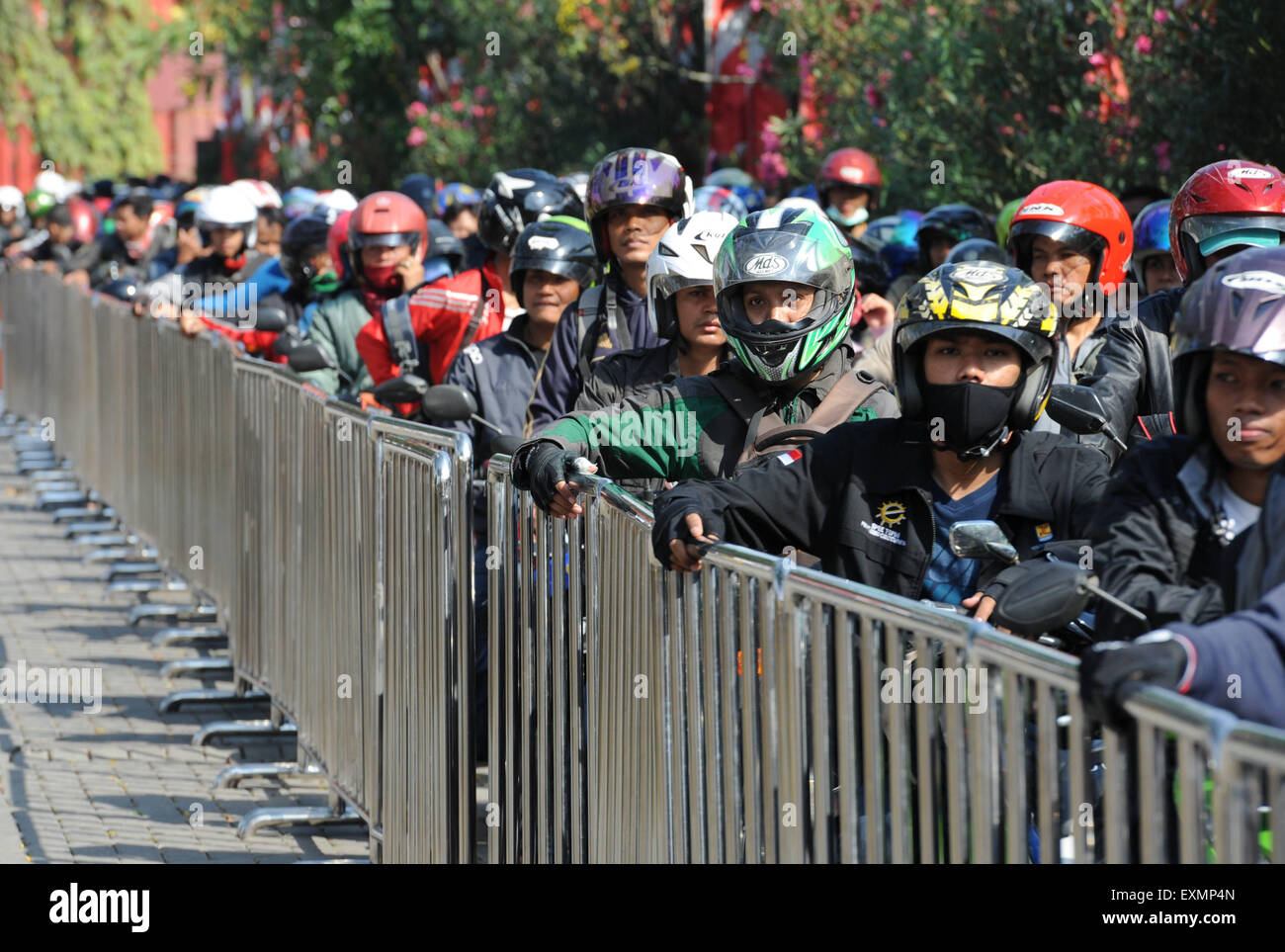 Jakarta, Indonesia. 15th July, 2015. Motorbike riders queue to board a ferry ship in Jakarta, Indonesia, July 15, 2015. Indonesia's traffic reaches its peak as millions of people travel to their hometowns to celebrate the upcoming Eid al-Fitr festival. Credit:  He Changshan/Xinhua/Alamy Live News Stock Photo