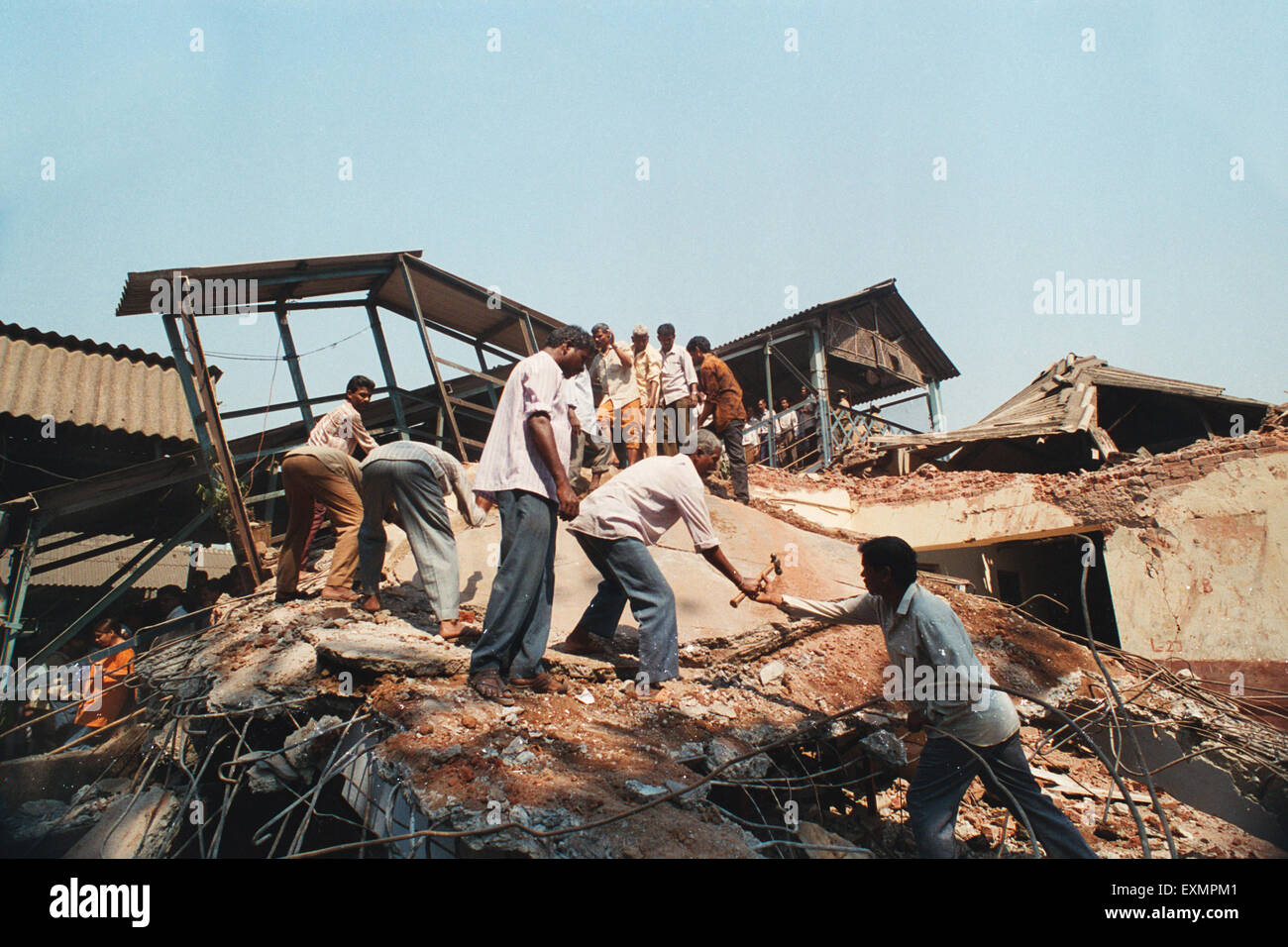demolishing breaking illegal unauthorised structure bombay mumbai maharashtra india asia Stock Photo