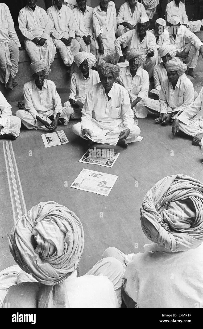 Village panchayat meeting at landlord house courtyard ; Munagoli ; Mangoli  ; Managuli ; Managoli ; Bijapur ; Karnataka ; India ; Asia ; old vintage 1900s picture Stock Photo