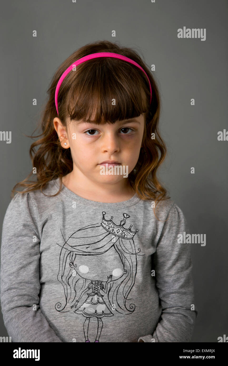 Portrait of young girl with a bruise or black eye on her left side ...