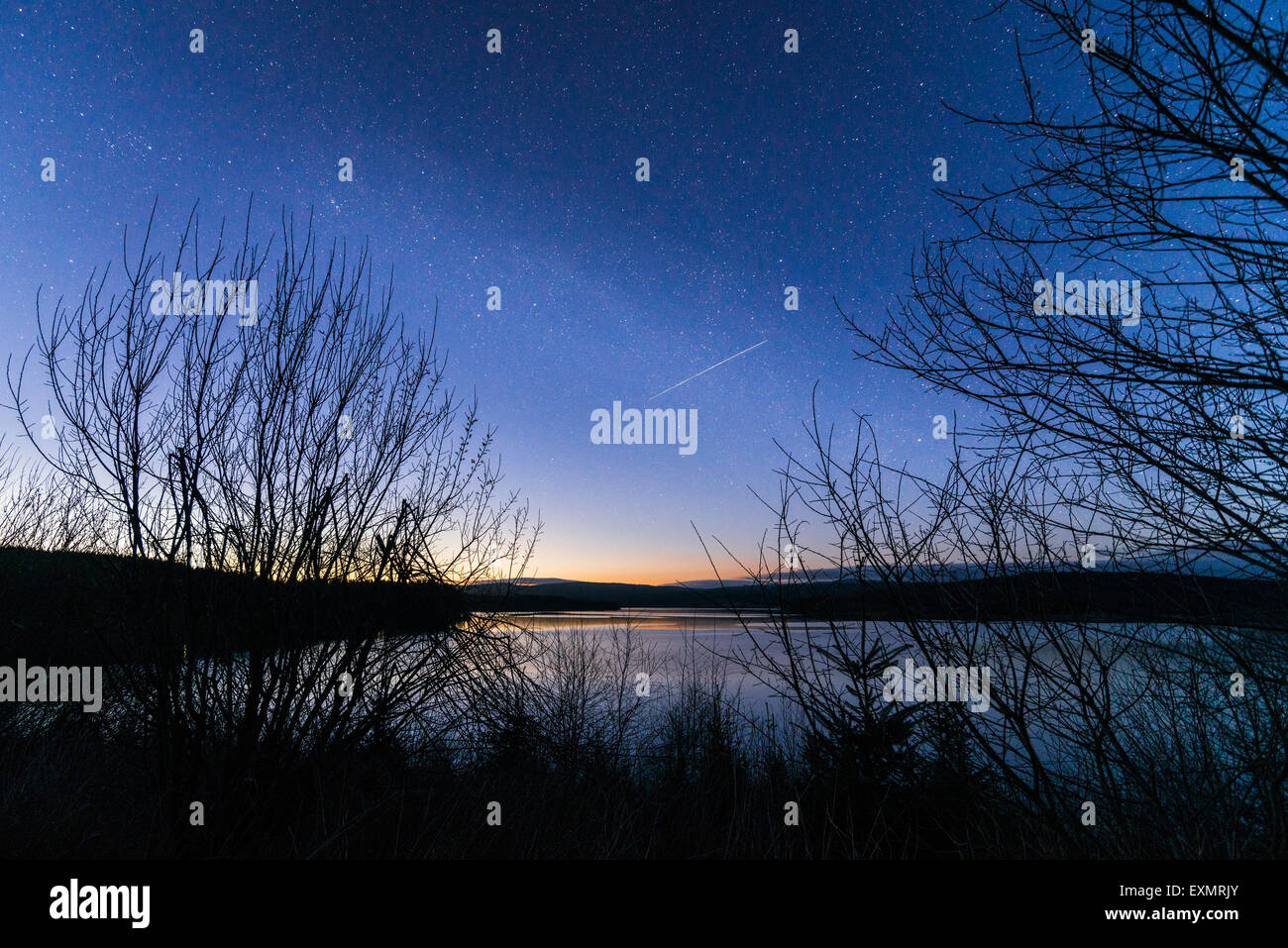 Shooting star over Kielder Reservoir Stock Photo