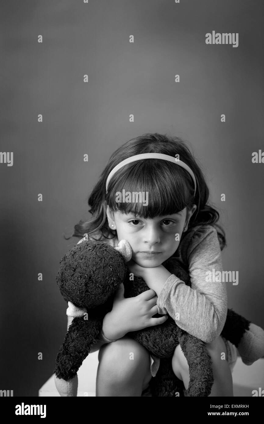 Portrait of young girl with a bruise or black eye on her left side, . This is a model, model released. Vertical color photograph Stock Photo