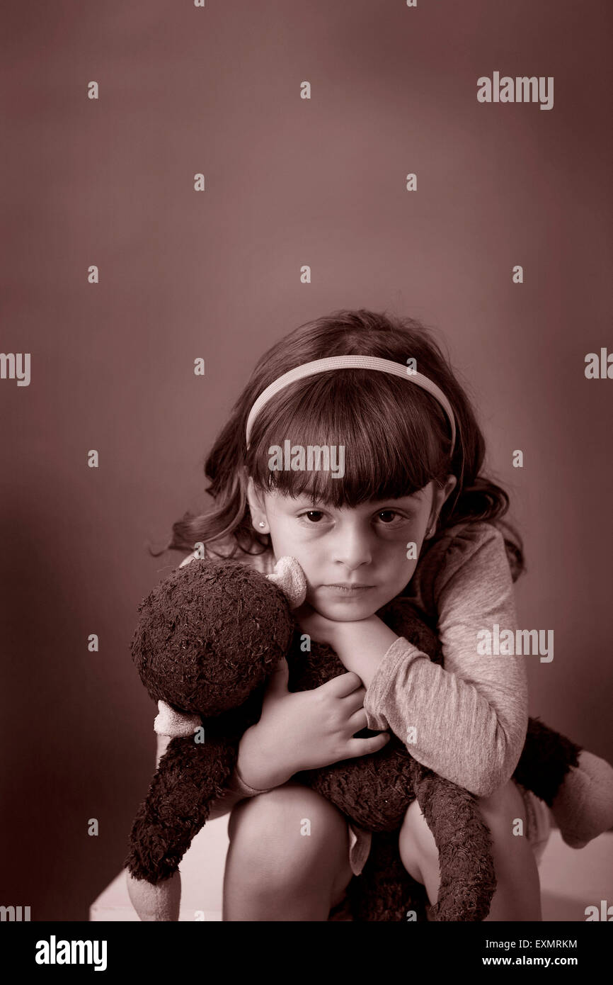 Portrait of young girl with a bruise or black eye on her left side ...