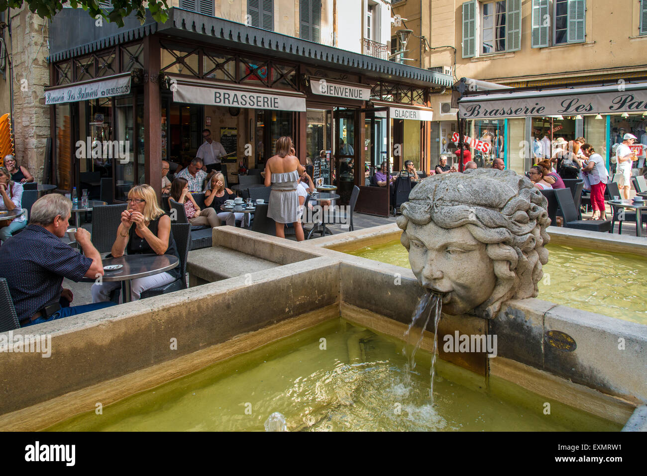 Brasserie cafe restaurant with people seated outside at tables, Carpentras, Provence, France Stock Photo