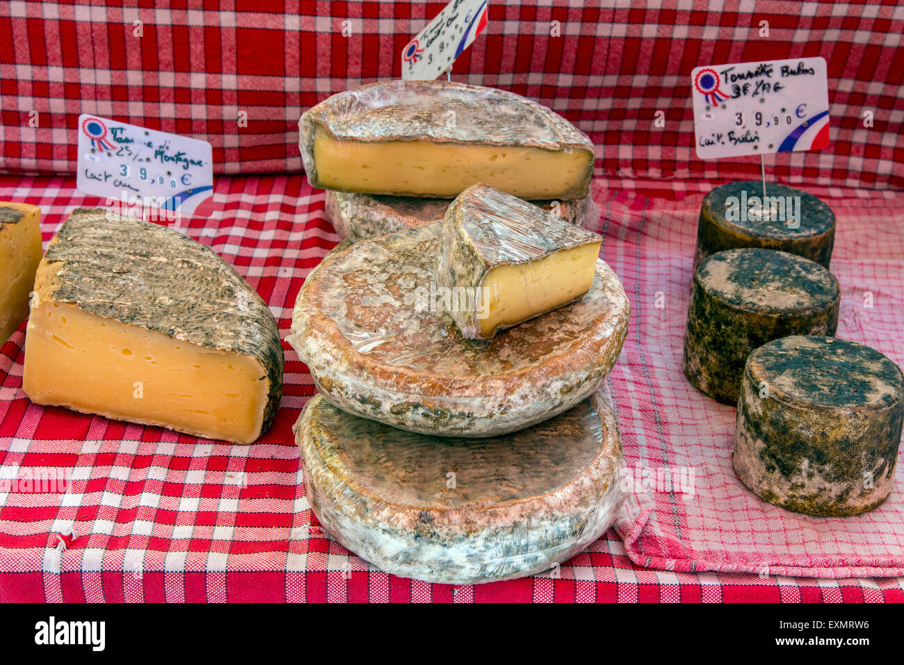 Local cheeses on sale at the market, Carpentras, Provence, France Stock Photo