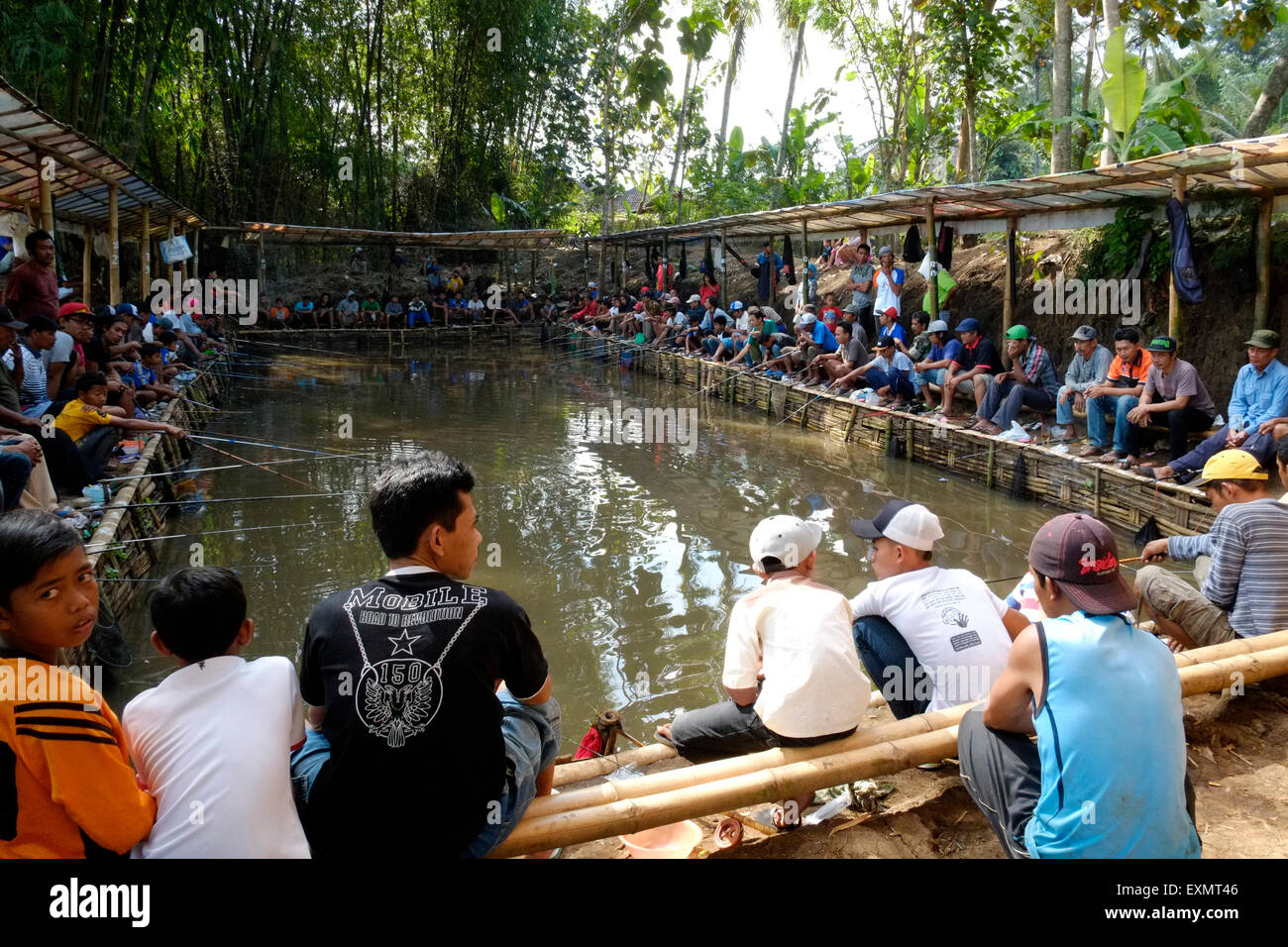 fishing indonesian style at a popular rural village man made pool