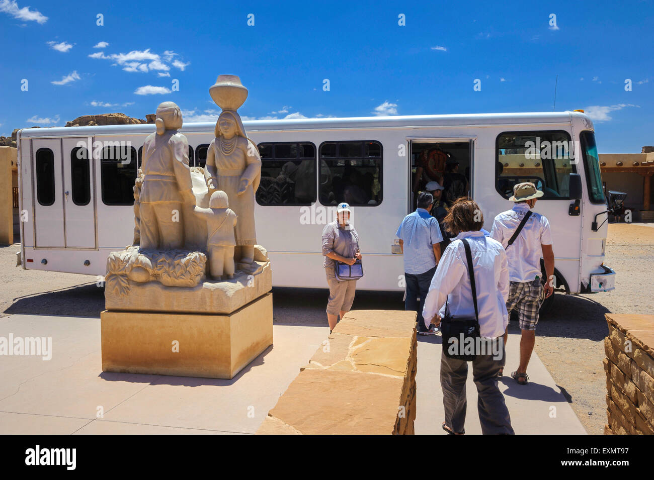 Tourists boarding the shuttle bus from the Sky City Cultural Center. Acoma Pueblo. Cibola County, New Mexico. USA Stock Photo