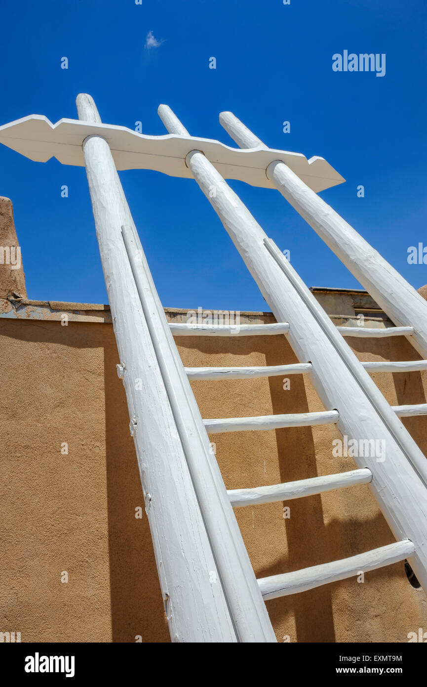 Wooden ladder leads to the entrance of a Kiva. Acoma Pueblo. Cibola County, New Mexico, USA Stock Photo