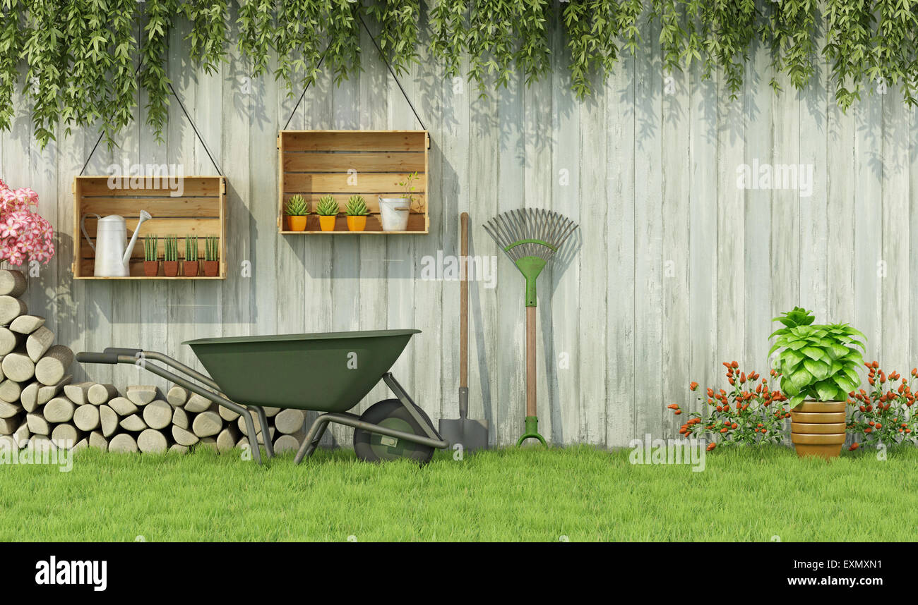 Tools for gardening in a garden with  old wooden fence-3d rendering Stock Photo
