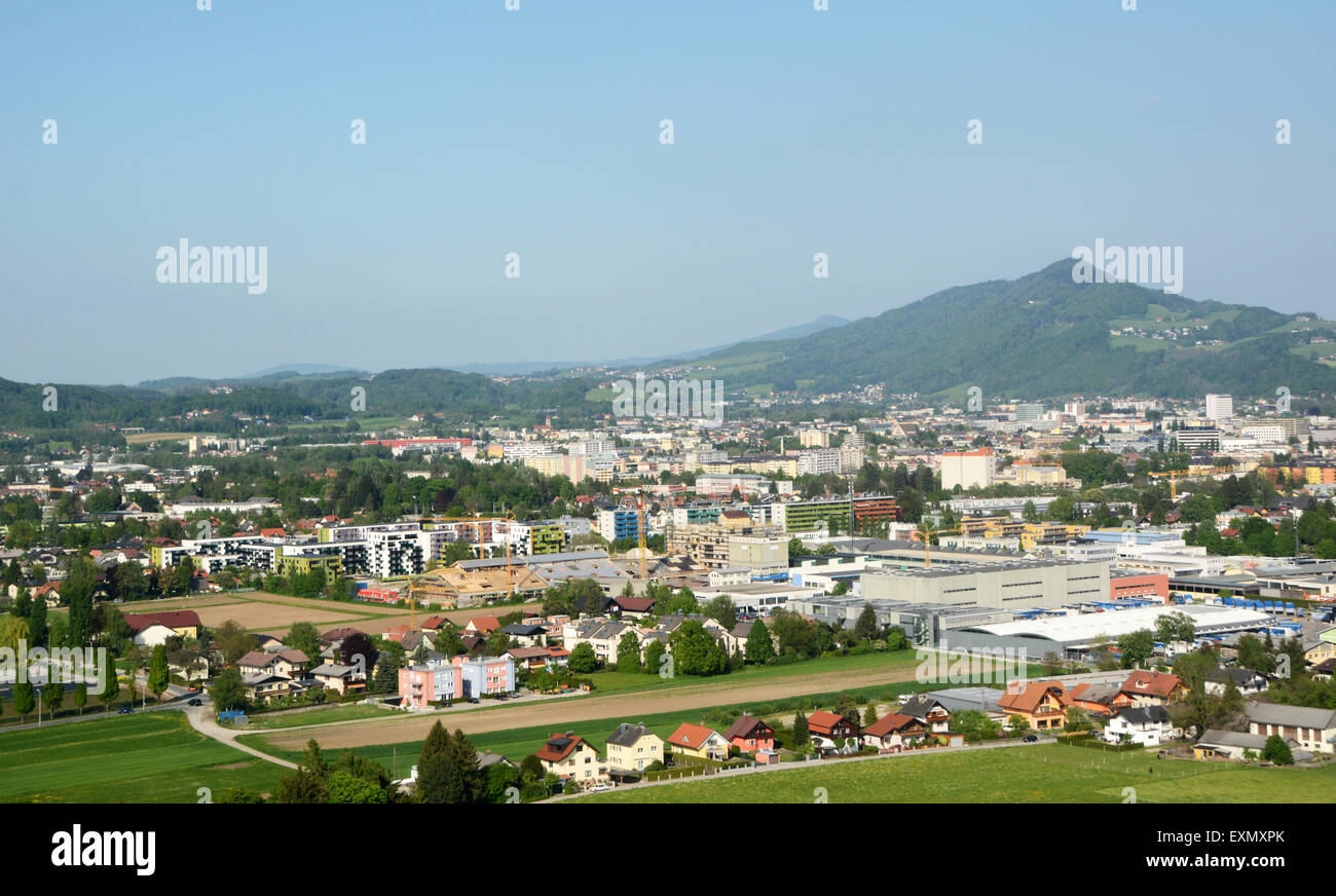 Aerial view of the outskirts of the city of Salzburg, Austria, with colourful houses, industrial buildings and construction site Stock Photo