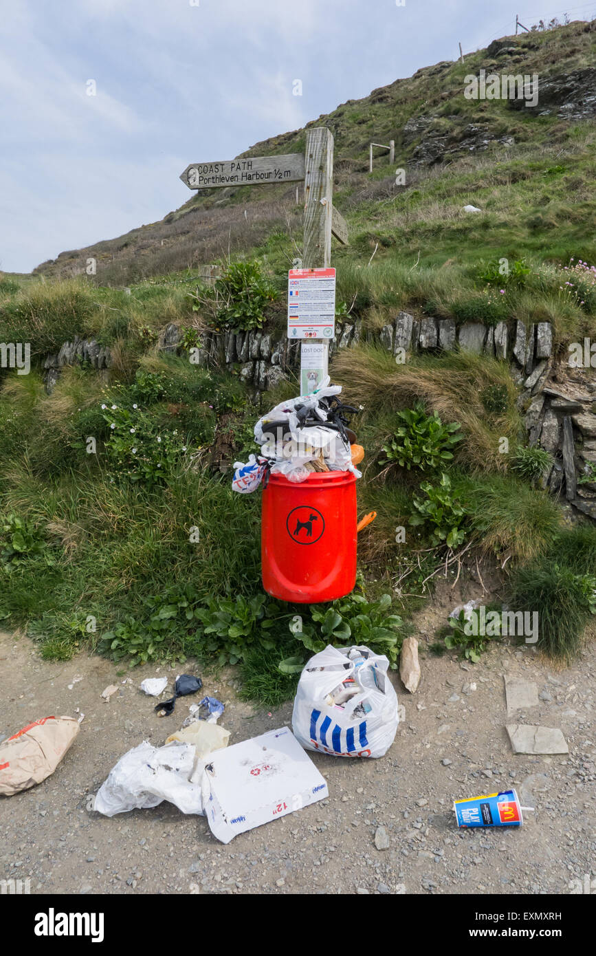 Coastal path, Cornwall. Rubbish overflowing bin. Stock Photo