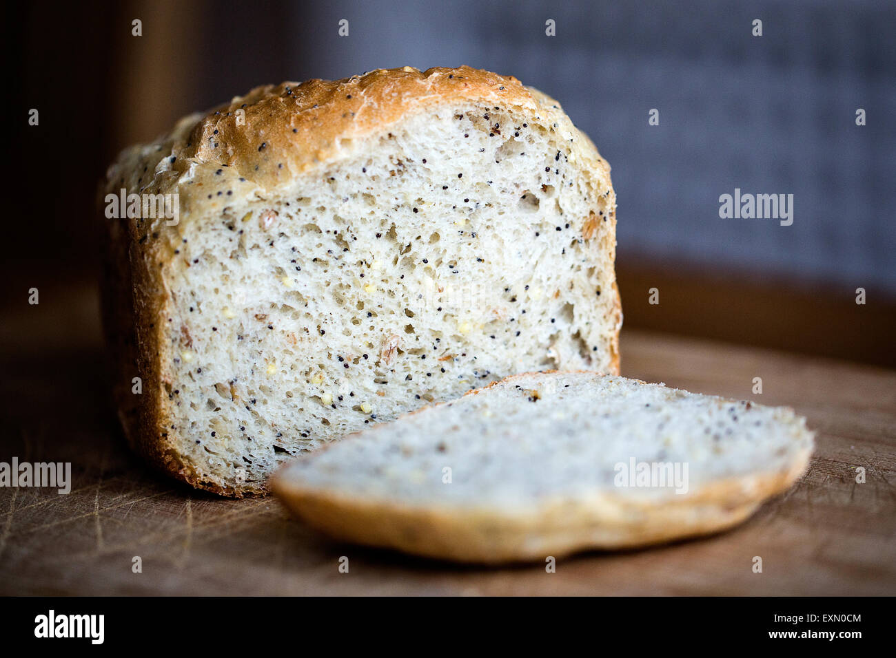 A multi grain loaf of home cooked white bread. This has been freshly made in a domestic bread making machine and is ready to be eaten Stock Photo
