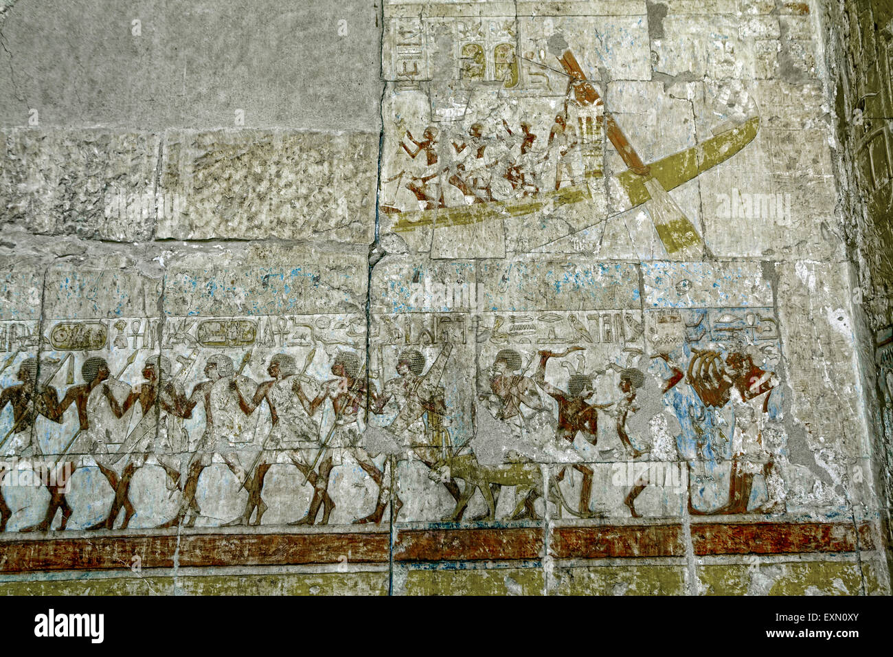 Ancient paintings on the walls inside the temple of Hatshepsut in Luxor Egypt. Stock Photo