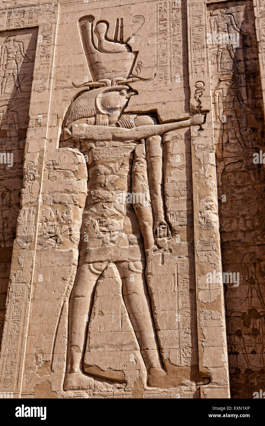 Ancient carvings on the walls found the temple of Idfu in Egypt. Stock Photo