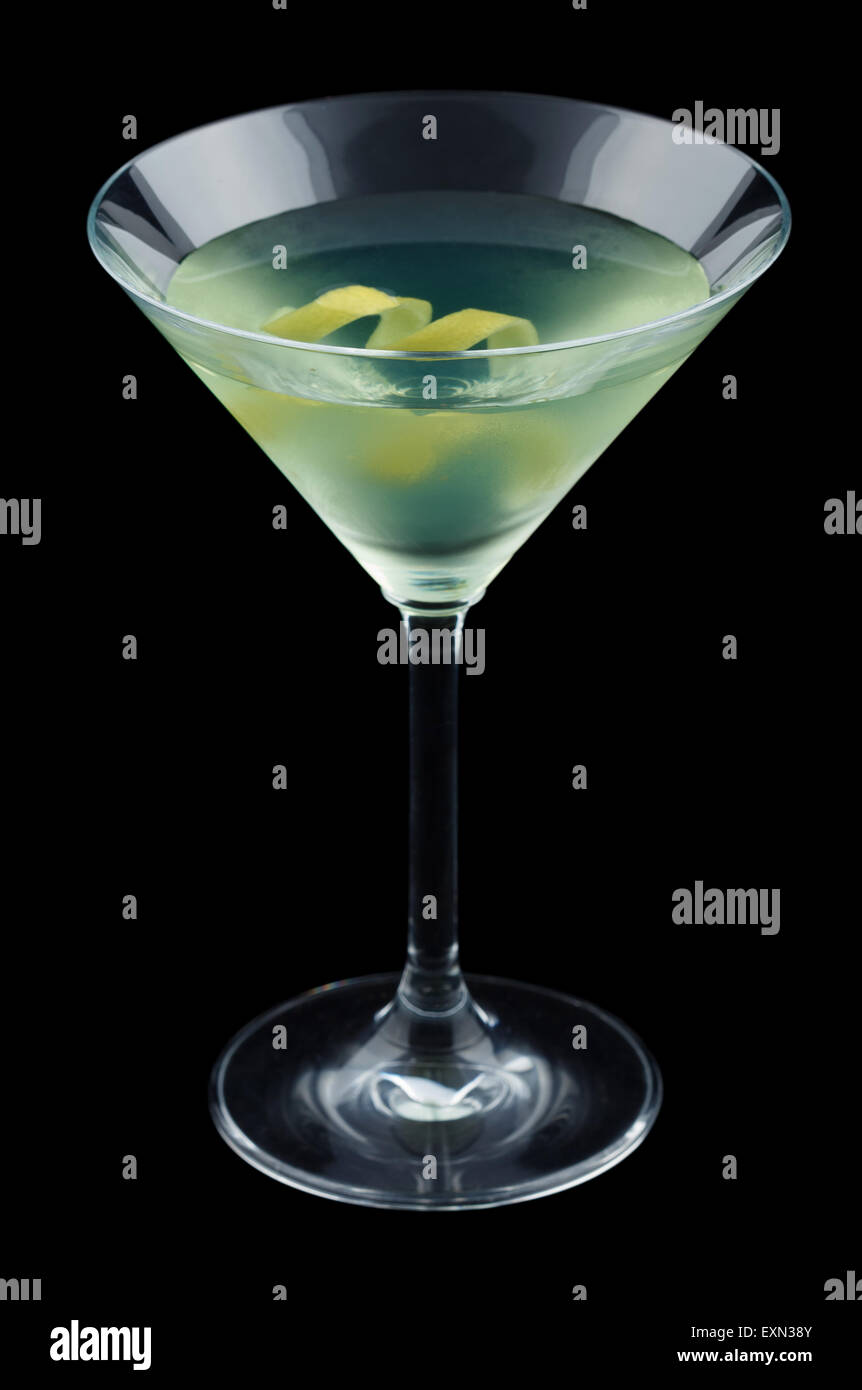Bijou cocktail with lemon twist isolated on black background Stock Photo