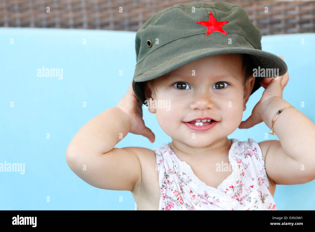 Baby girl with vietnamese baseball cap Stock Photo