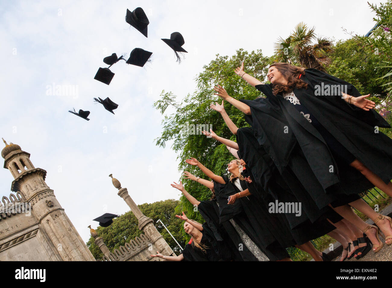 Brighton, Sussex, UK. 15th July, 2015. Sussex University students throw their mortar boards into the air to celebrate Graduation Day on Wednesday 15 July 2015 in Brighton, East Sussex, UK Credit:  DB Pictures/Alamy Live News Stock Photo