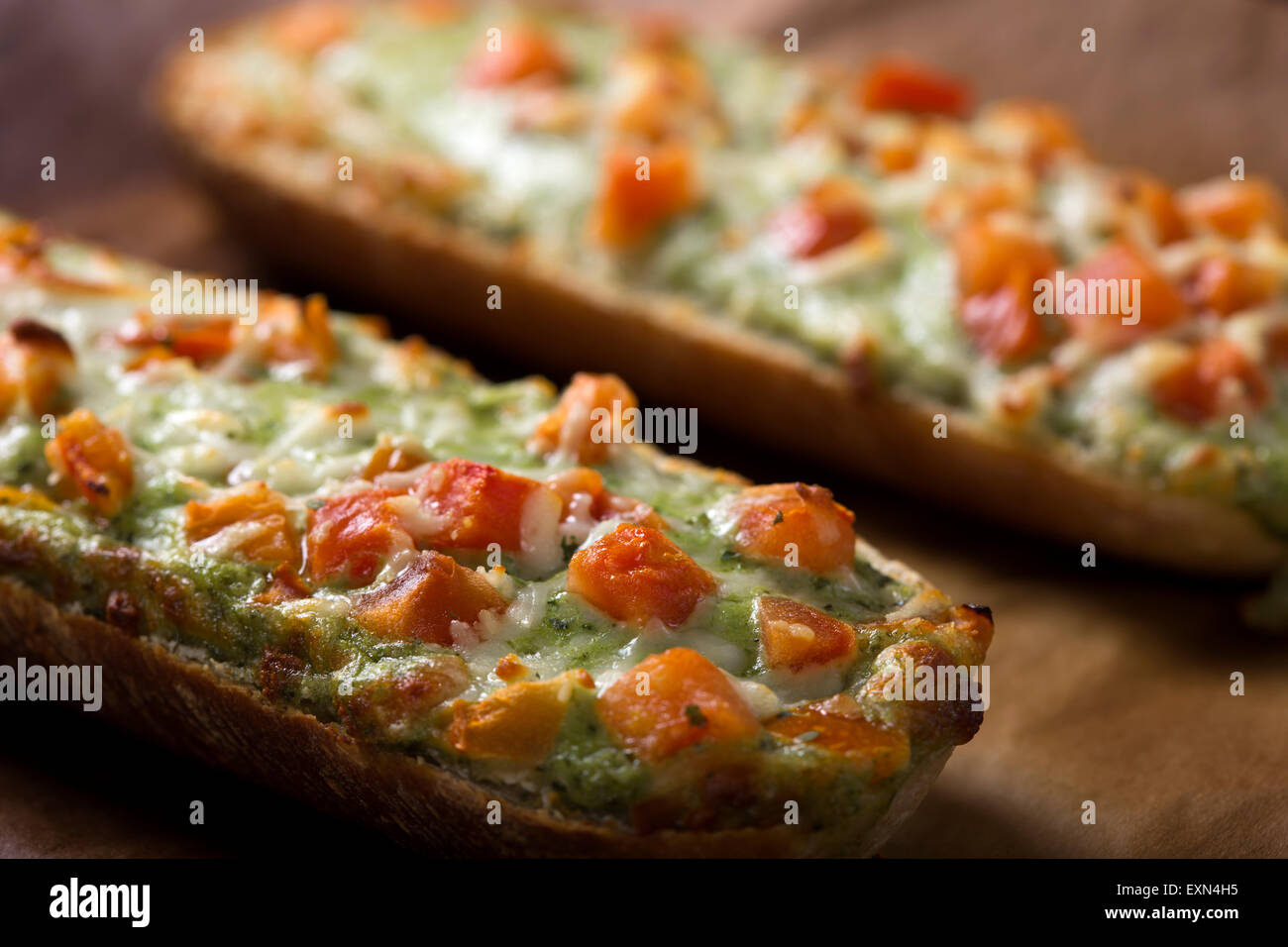 Close up of Baguettes with pesto on rustic background Stock Photo
