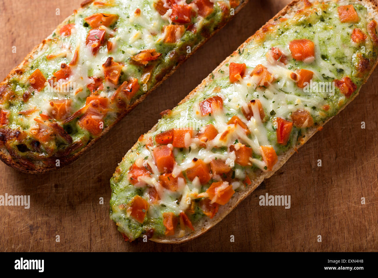 Baguettes with pesto on rustic background Stock Photo