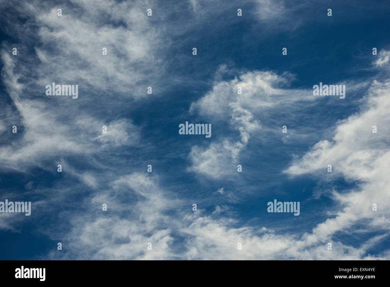 White clouds against a blue sky Stock Photo - Alamy