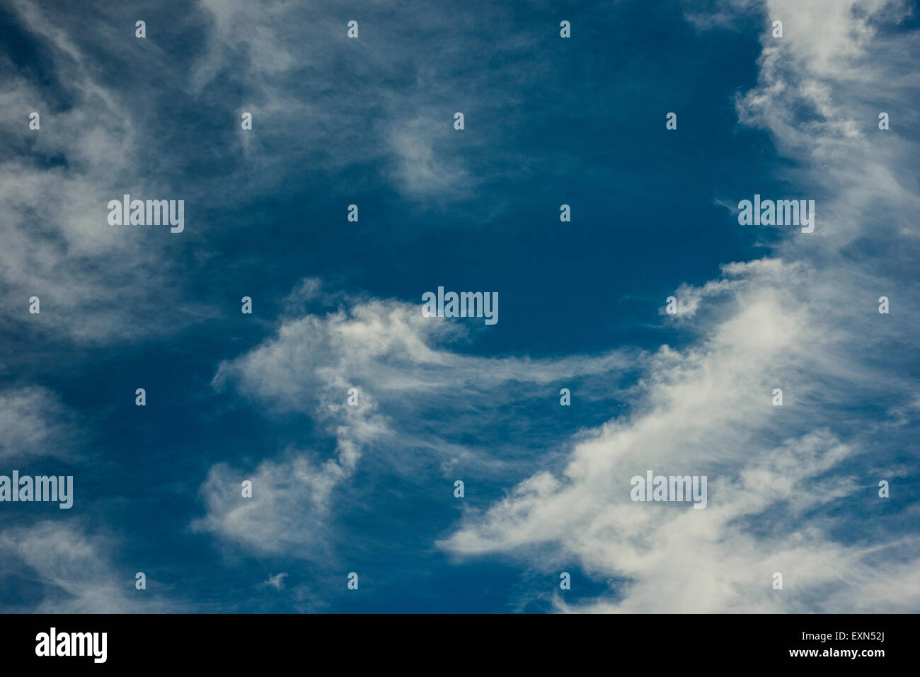 White clouds against a blue sky Stock Photo - Alamy