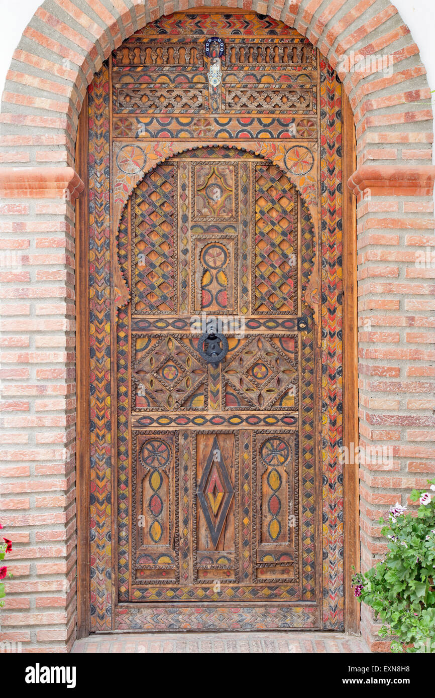 GRANADA, SPAIN - MAY 30, 2015: The door of house in mudejar style. Stock Photo