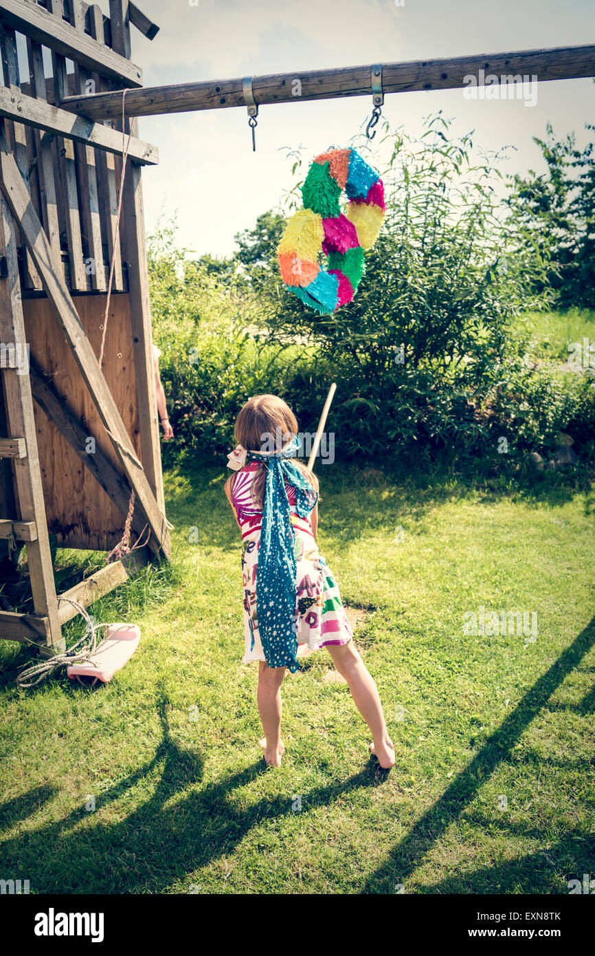 https://c8.alamy.com/comp/EXN8TK/girl-with-pinata-formed-like-an-eight-in-the-garden-EXN8TK.jpg