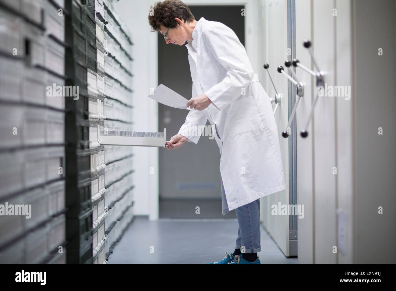 Laboratory assistant in sample archive of clinical laboratory Stock Photo