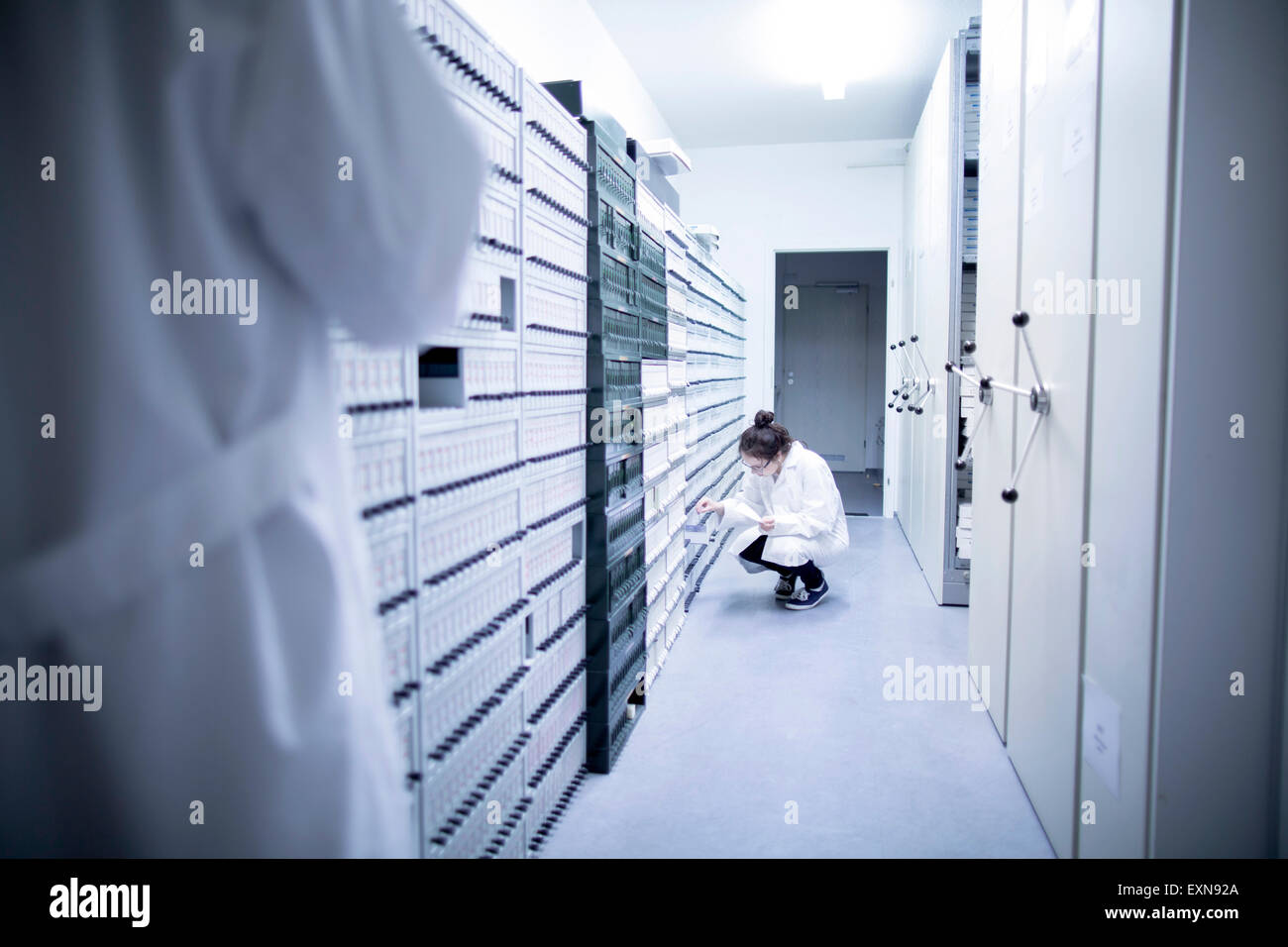 Laboratory assistants in sample archive of clinical laboratory Stock Photo