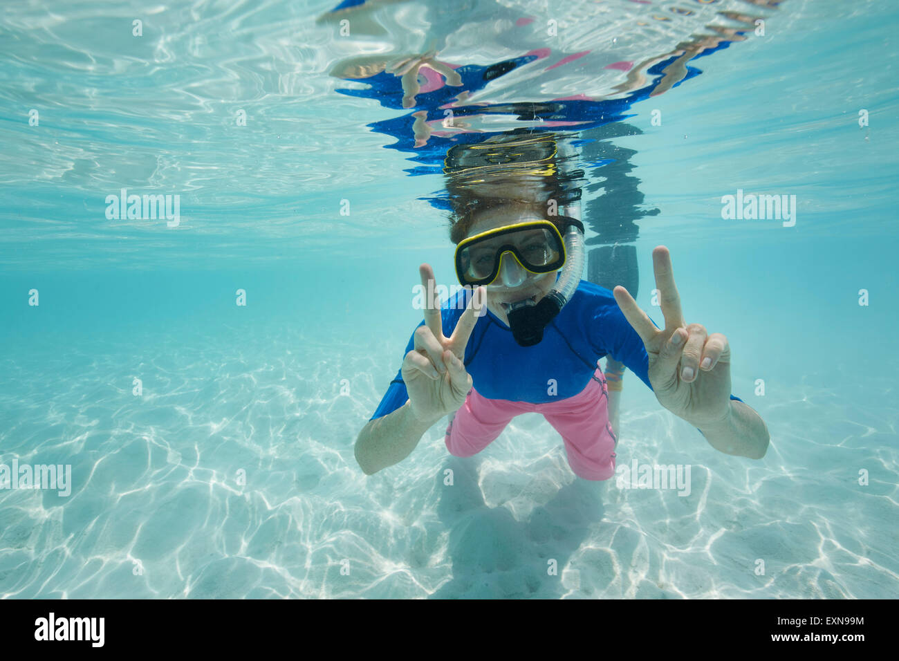 Maldives, happy woman snorkeling in the Indian Ocean Stock Photo
