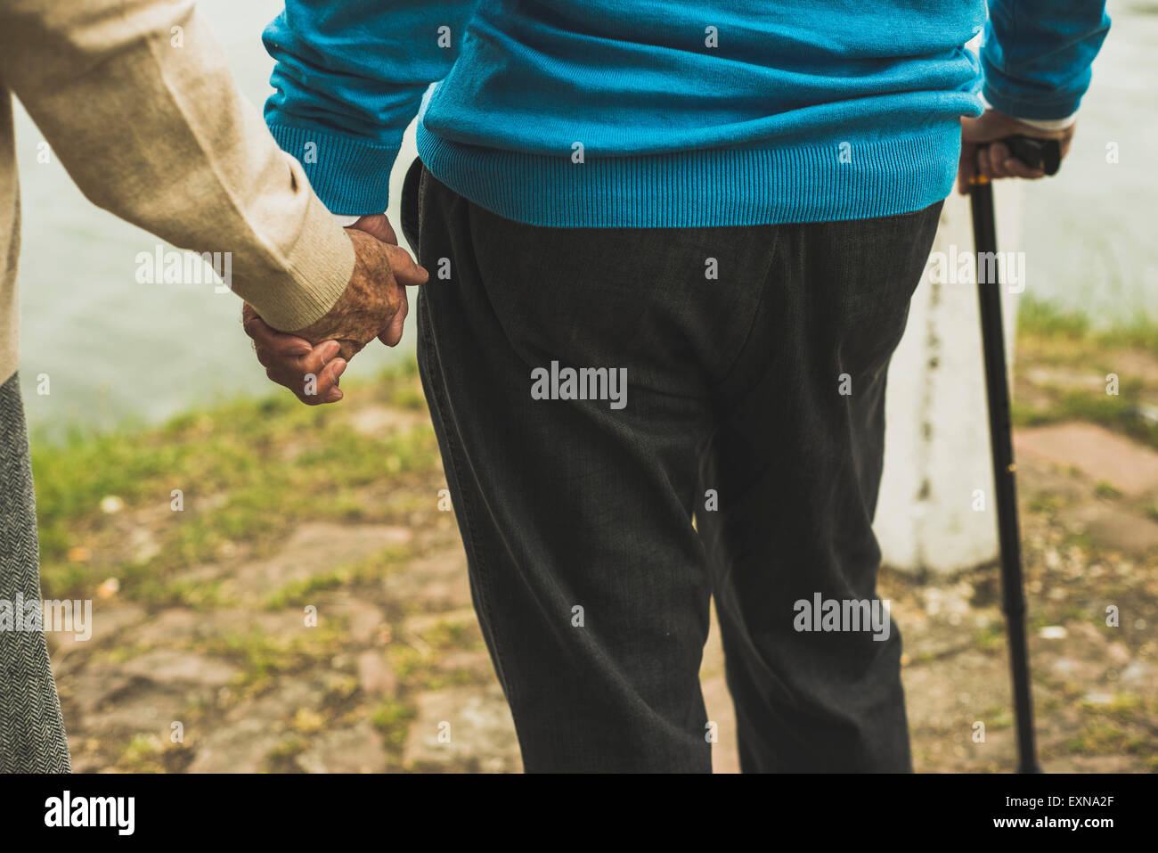 Old men holding hands hi-res stock photography and images - Alamy