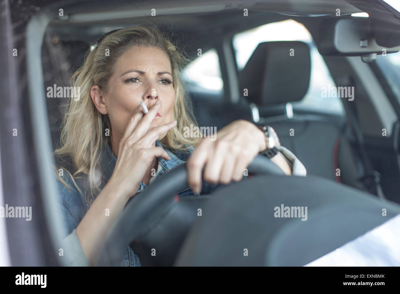 Woman smoking cigarette in car hires stock photography and images Alamy