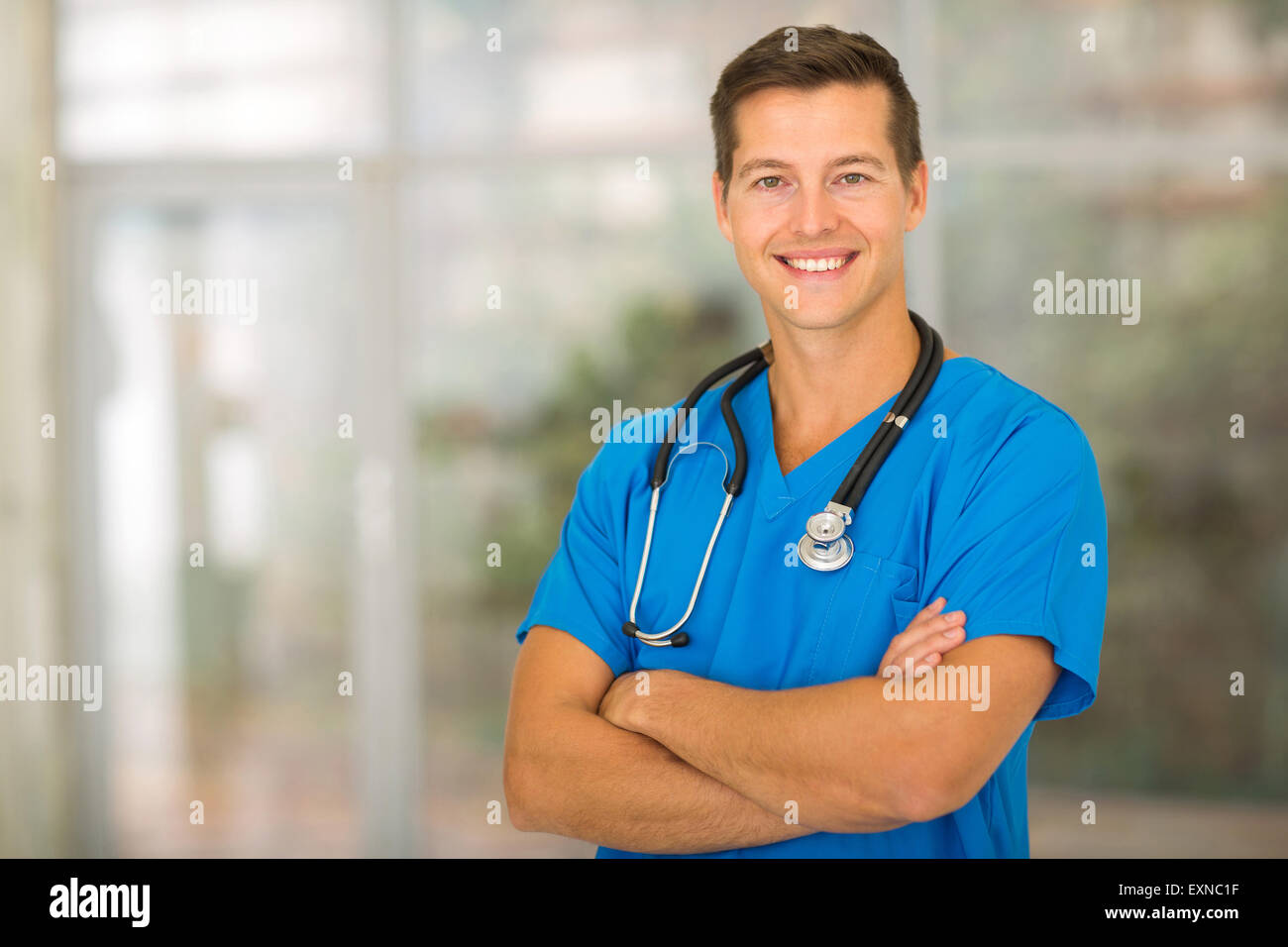 good looking medical intern with arms crossed Stock Photo