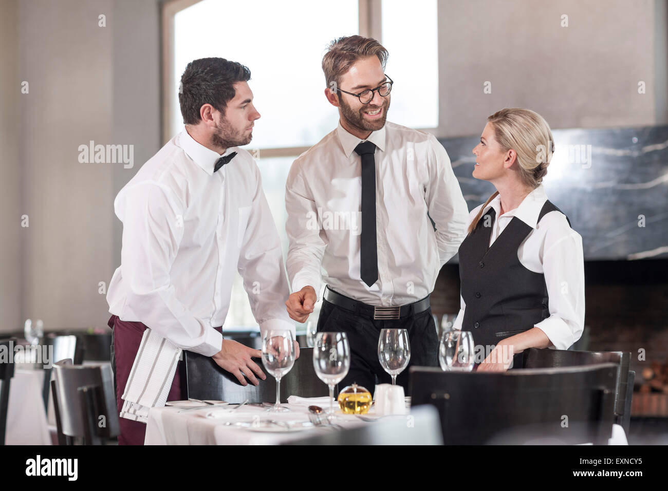 Restaurant staff setting tables Stock Photo Alamy