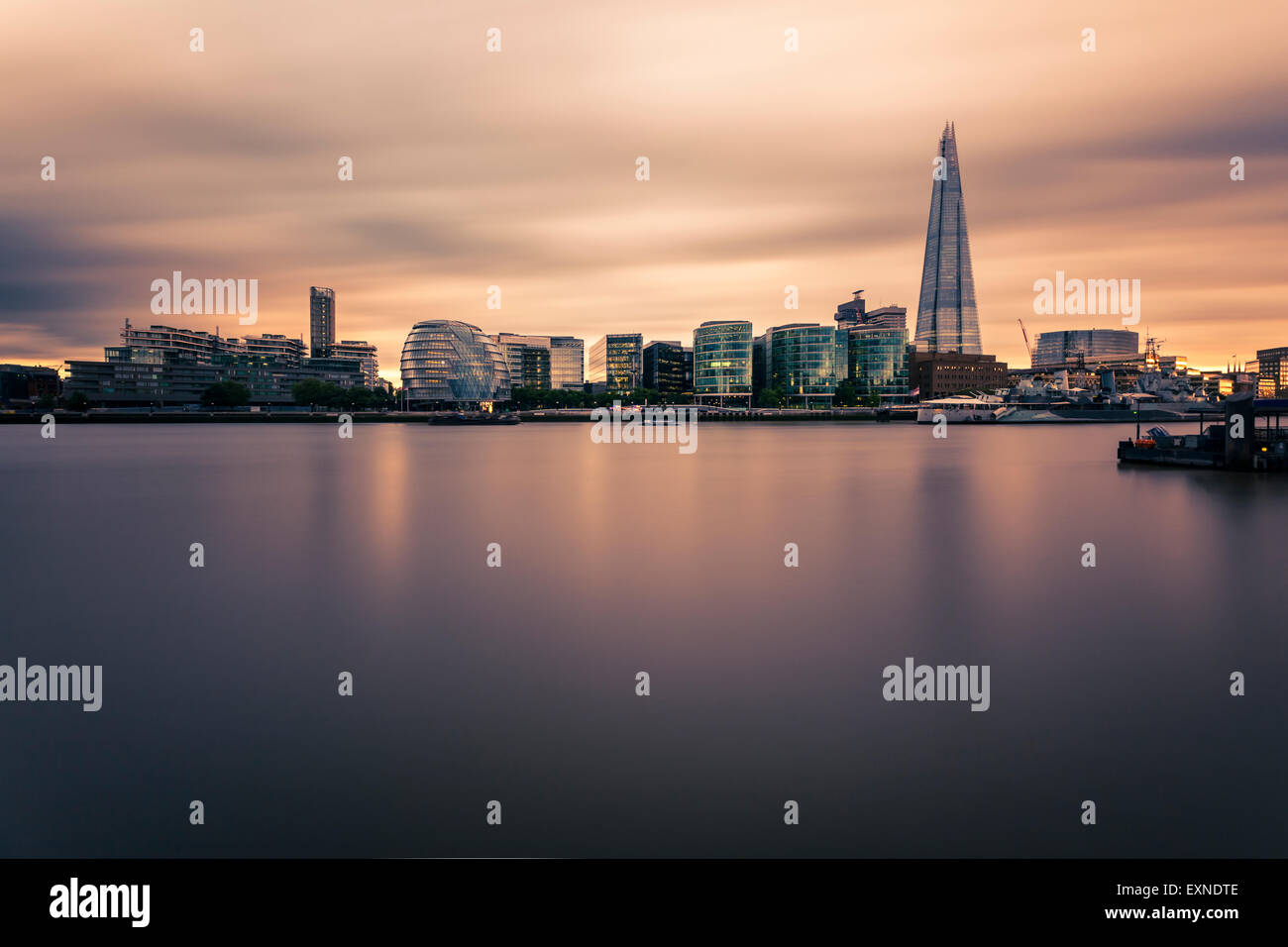 UK, London, view to River Thames with modern office buildings in the background, long exposure Stock Photo