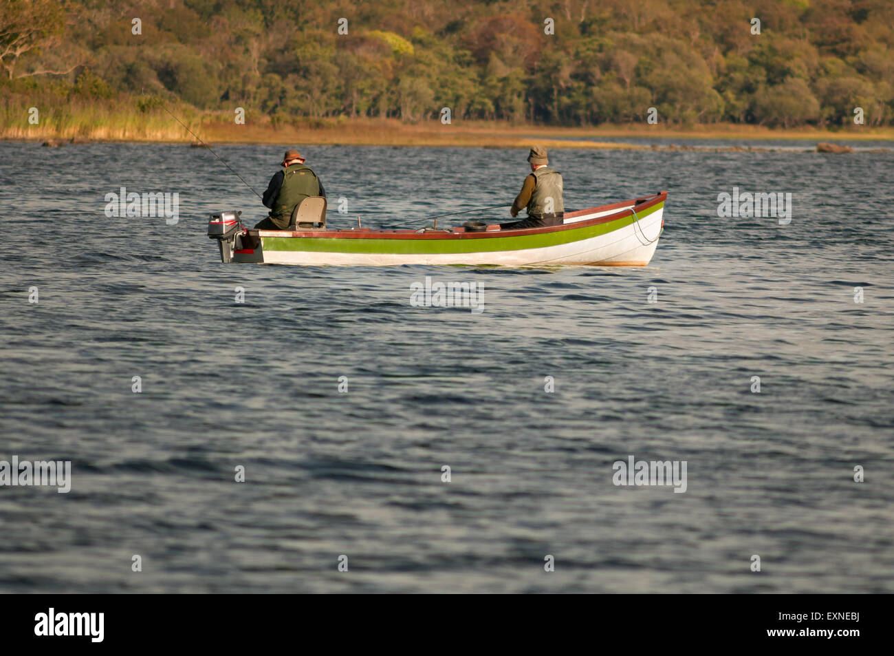 Fishing Ireland and two fishermen in fishing boat fly fishing in the Lakes of Killarney in Killarney National Park, County Kerry, Ireland Europe Stock Photo