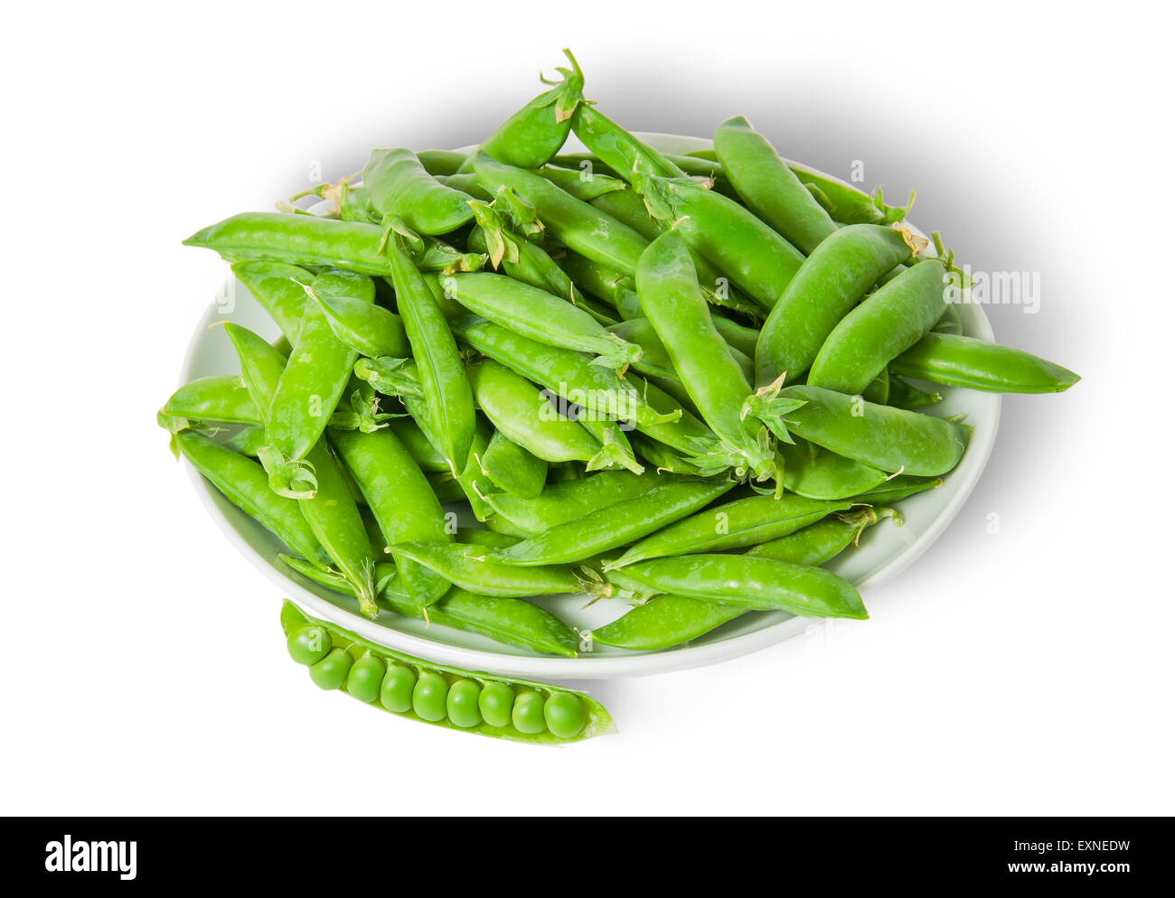 Opening and closing pea pods on white plate top view isolated on white background Stock Photo