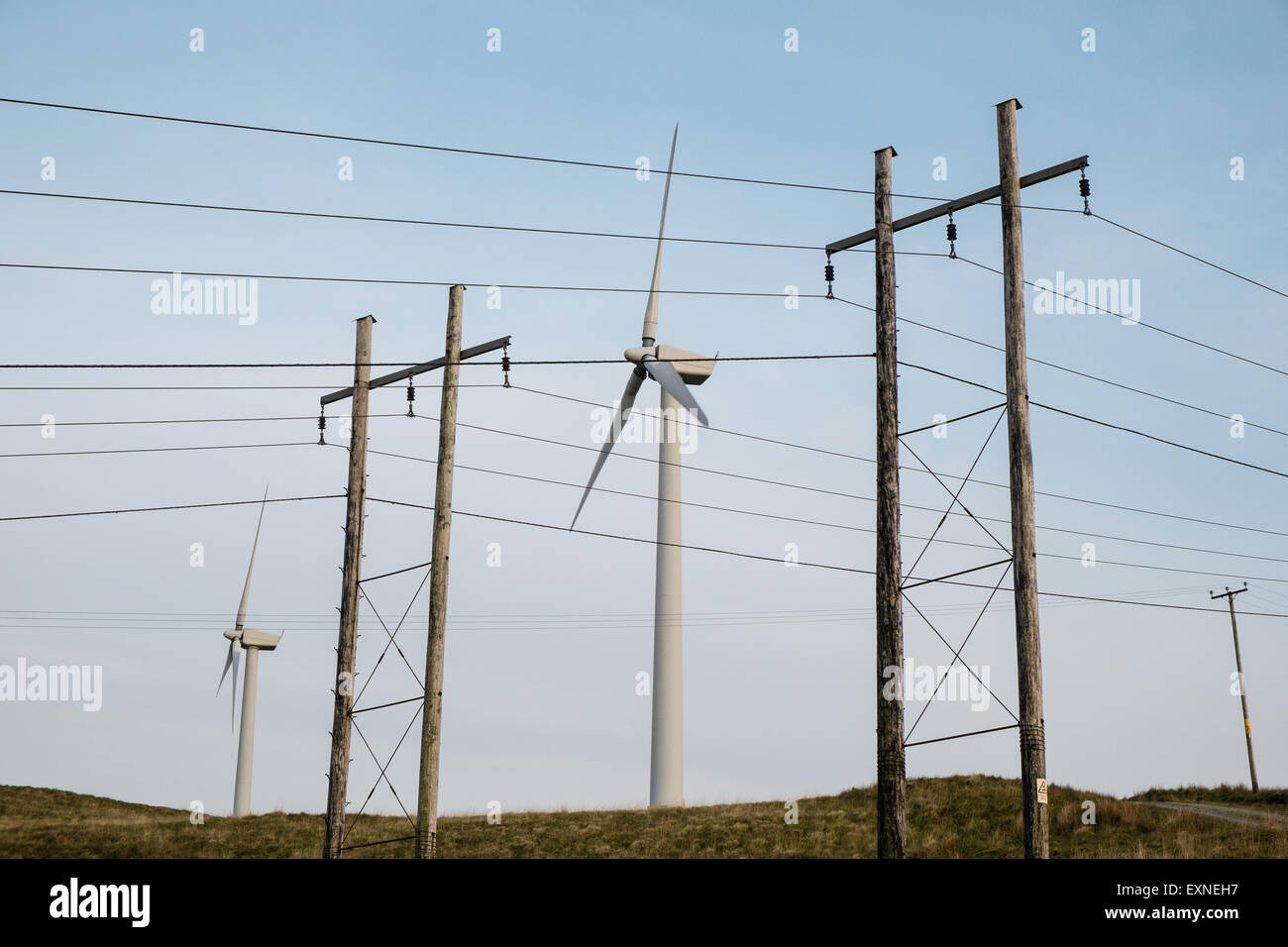 Pylons carrying electricity from Rheidol Hydro Power Station and Wind Turbines at Rheidol wind farm,turbine,power,Wales,Powys, Stock Photo