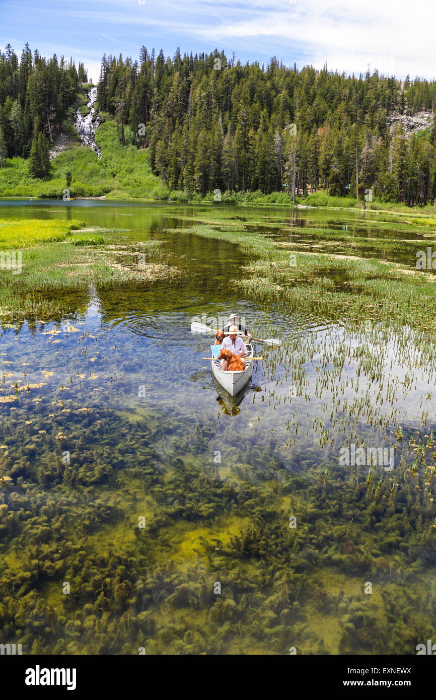 Canoe with couple and dogs in Twin Lakes in the Mammoth Lakes Basin in