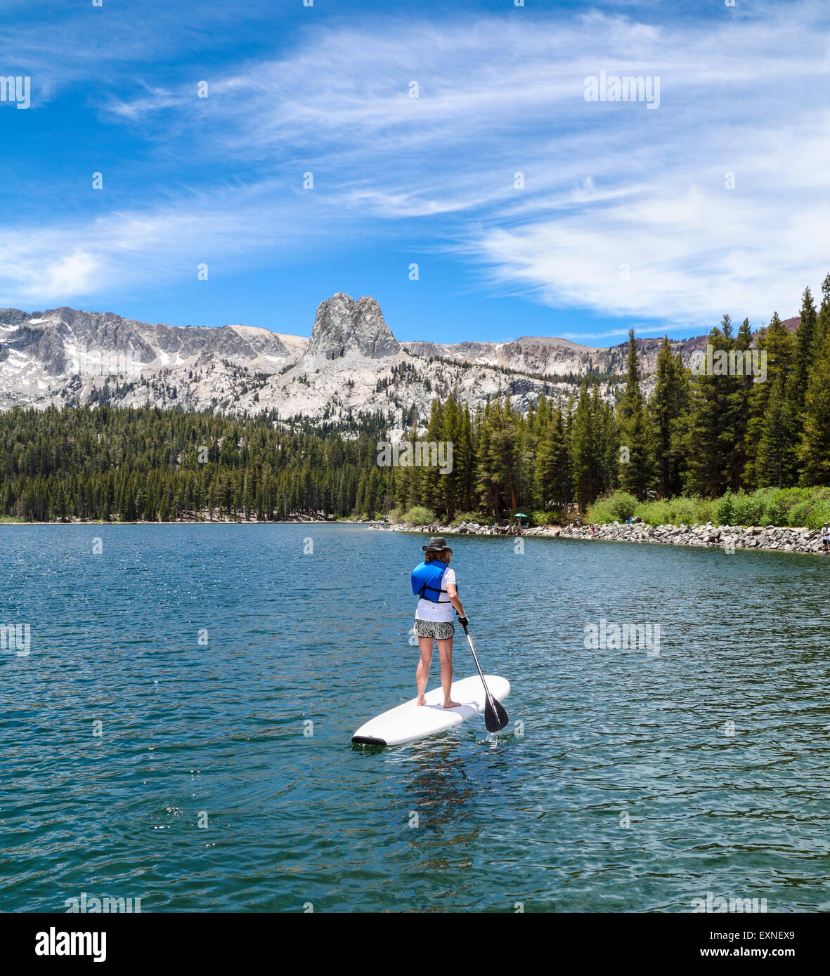 Stand up paddle boarder in Lake Mary in the Mammoth Lakes Basin in Northern Calfiornia Stock Photo